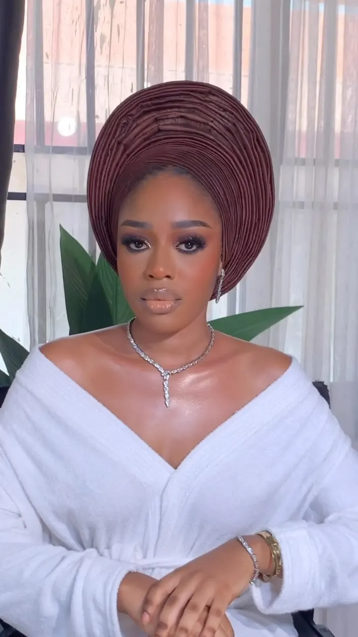 Soft glam makeup with gele by Modupe Oge