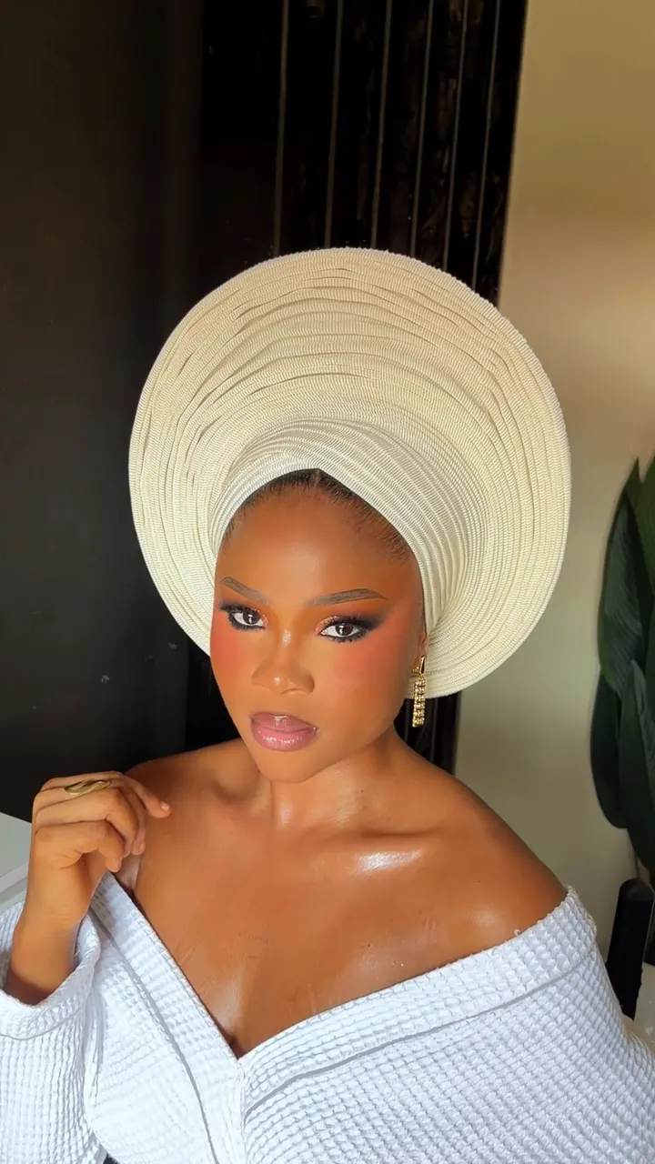 Glam makeup and styled gele by Modupe Oge
