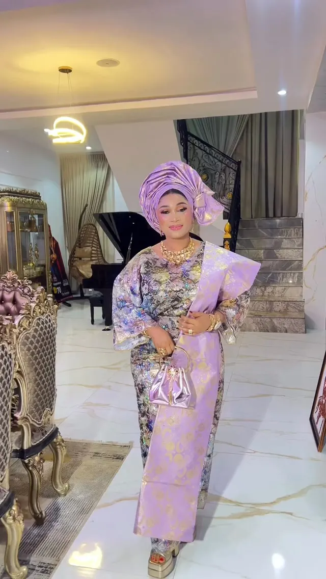 Elegant makeup and gele for a celebrant by Modupe Oge